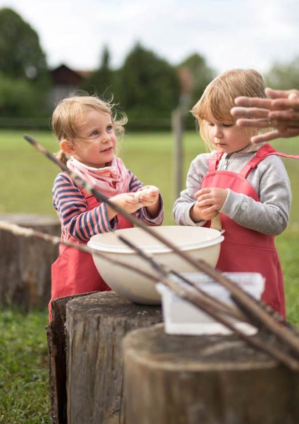Roasting bread on a stick around the campfire