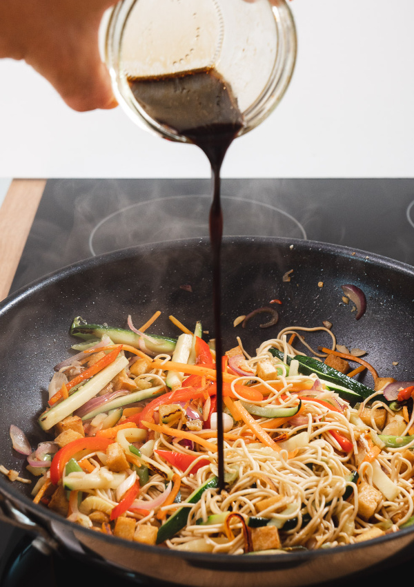 Wok at the front cooking
